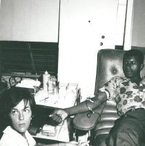 Analice Decker, Medical Technologist, drawing a blood donor.